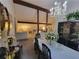 Dining room with table set for dinner and view into living room with chandelier at 3723 Raiders Ridge Dr, Lithonia, GA 30038