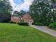 Two story brick home with well maintained lawn and attached two car garage at 3723 Raiders Ridge Dr, Lithonia, GA 30038