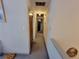 Hallway with neutral walls leading to rooms, showing interior architecture at 3723 Raiders Ridge Dr, Lithonia, GA 30038