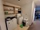 Laundry room featuring a washer, dryer, and shelves at 3723 Raiders Ridge Dr, Lithonia, GA 30038