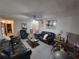 View of living room featuring couches and a ceiling fan at 3723 Raiders Ridge Dr, Lithonia, GA 30038