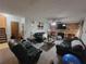 Spacious living room with brick fireplace and ceiling fan at 3723 Raiders Ridge Dr, Lithonia, GA 30038