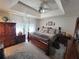 Spacious main bedroom with ceiling fan, tray ceiling, and abundant natural light at 3723 Raiders Ridge Dr, Lithonia, GA 30038