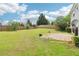 Spacious backyard with a wooden fence and an inviting stone patio area for outdoor living at 5512 Village Rdg, Fairburn, GA 30213