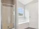 Bathroom featuring a walk-in shower and separate tub at 5512 Village Rdg, Fairburn, GA 30213