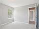 The bedroom offers plush carpeting, and a window to provide natural light at 5512 Village Rdg, Fairburn, GA 30213