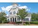 Charming community clubhouse featuring a clock tower, perfect for gatherings at 5512 Village Rdg, Fairburn, GA 30213