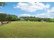 Lush green space featuring a charming gazebo and mature trees create a serene community atmosphere at 5512 Village Rdg, Fairburn, GA 30213