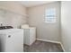 Laundry room featuring washer, dryer, and wire shelving at 5512 Village Rdg, Fairburn, GA 30213