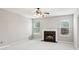 Cozy living room with a fireplace, neutral walls, and ample natural light at 5512 Village Rdg, Fairburn, GA 30213
