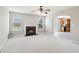 Elegant dining area with views of the living room and a modern glass table at 5512 Village Rdg, Fairburn, GA 30213