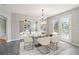 Living room featuring fireplace, ceiling fan, with views into the kitchen area at 5512 Village Rdg, Fairburn, GA 30213