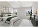 Inviting main bedroom with neutral tones, ample natural light, and stylish decor creates a soothing retreat at 5512 Village Rdg, Fairburn, GA 30213