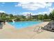 Large community pool with a slide and plenty of lounge chairs for sunny days at 5512 Village Rdg, Fairburn, GA 30213