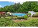 Community pool with a thrilling water slide and lounge chairs for relaxation at 5512 Village Rdg, Fairburn, GA 30213