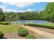 Community tennis courts surrounded by lush trees, great for staying active at 5512 Village Rdg, Fairburn, GA 30213