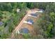 Expansive aerial view of multiple homes in a residential development with trees at 160 Doris Path, Dallas, GA 30157