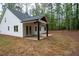 Charming backyard with a covered patio, perfect for enjoying the outdoors and relaxing at 160 Doris Path, Dallas, GA 30157