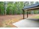 Spacious covered patio and picturesque view of private, wooded backyard at 160 Doris Path, Dallas, GA 30157