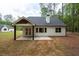 Cozy backyard with a covered patio, providing a comfortable outdoor living space at 160 Doris Path, Dallas, GA 30157