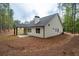 Exterior view showcasing the backyard with a patio and landscape design at 160 Doris Path, Dallas, GA 30157