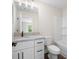 Well-lit bathroom showcasing granite countertops and a shower-tub combination at 160 Doris Path, Dallas, GA 30157