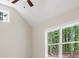 Cozy bedroom with natural light shining through the windows showcasing the exterior landscape at 160 Doris Path, Dallas, GA 30157