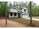Charming new construction home featuring white siding, dark roof, and a two-car garage at 160 Doris Path, Dallas, GA 30157