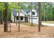 Charming home with a two-car garage, complemented by trees at 160 Doris Path, Dallas, GA 30157