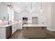 Well-appointed kitchen with an island, white cabinetry, and stainless steel appliances at 160 Doris Path, Dallas, GA 30157