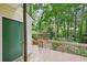 Cozy back porch offers a serene view of the surrounding greenery at 187 Timber Creek Sw Ln, Marietta, GA 30060