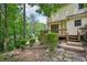 Backyard view features a multi-level deck and natural landscaping at 187 Timber Creek Sw Ln, Marietta, GA 30060