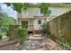 Exterior backyard view features a multi-level deck and natural landscaping at 187 Timber Creek Sw Ln, Marietta, GA 30060