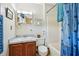 Cozy bathroom features a sink with storage and a bathtub with a charming seashell-themed shower curtain at 187 Timber Creek Sw Ln, Marietta, GA 30060