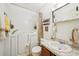 Bathroom equipped with walk-in tub, sink and cabinet storage, and a decorative mirror at 187 Timber Creek Sw Ln, Marietta, GA 30060