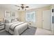 A well-lit bedroom with a ceiling fan, and a bathroom for a functional design at 187 Timber Creek Sw Ln, Marietta, GA 30060