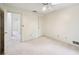 Spacious bedroom with neutral carpet, ceiling fan, and easy access to the rest of the home at 187 Timber Creek Sw Ln, Marietta, GA 30060
