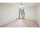 Bright bedroom with neutral carpet, ceiling fan, and a window overlooking the greenery outside at 187 Timber Creek Sw Ln, Marietta, GA 30060
