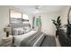 Serene bedroom features contemporary artwork, neutral tones, and a ceiling fan for added comfort at 187 Timber Creek Sw Ln, Marietta, GA 30060
