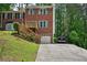 Charming two-story brick home with a front porch, attached garage, and landscaped front yard at 187 Timber Creek Sw Ln, Marietta, GA 30060