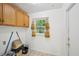 Laundry area featuring functional cabinets and a window offering natural light at 187 Timber Creek Sw Ln, Marietta, GA 30060
