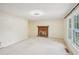 Spacious living room with fireplace and natural light from large windows creating a cozy atmosphere at 187 Timber Creek Sw Ln, Marietta, GA 30060
