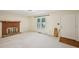 Cozy living room with a brick fireplace, large window and neutral carpet at 187 Timber Creek Sw Ln, Marietta, GA 30060