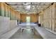 Unfinished basement area showcasing exposed framing and a recreation area with ping pong table at 238 Harmony Lake Dr, Canton, GA 30115