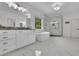 Bright bathroom with a soaking tub, glass shower, double sinks, and granite countertops at 238 Harmony Lake Dr, Canton, GA 30115