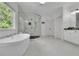 Stylish bathroom with a soaking tub, glass-enclosed shower, and modern fixtures at 238 Harmony Lake Dr, Canton, GA 30115