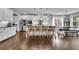 Bright kitchen featuring white cabinetry, stainless steel appliances, a large island, and hardwood floors at 238 Harmony Lake Dr, Canton, GA 30115