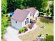 Aerial view of the home showcasing its updated roof, the inviting pool, and private backyard oasis at 3748 Woodrose Ct, Snellville, GA 30039