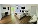 Spacious bedroom features modern decor, a desk, and sliding glass doors to a private deck at 3748 Woodrose Ct, Snellville, GA 30039