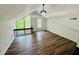 A spacious bonus room features wood floors and many windows at 3748 Woodrose Ct, Snellville, GA 30039